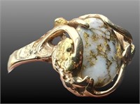 14kt Gold ring with a large quartz stone with gold