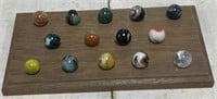 14 1" classic shooter marbles with display board