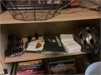 Shelf lot with bicycle helmet, snore, medic,