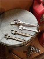 Four adjustable wrenches two of them are