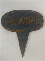Cast-iron welcome sign for your flower bed