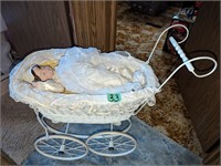 Iron baby carriage with doll