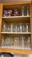 Glass mugs, glasses on 3 shelves