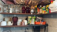 Two shelves of glass wear snd gardening supplies