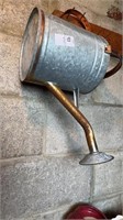 Small metal watering can along with small box and