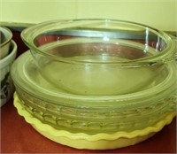 Yellow stoneware pie pan & clear pie pans