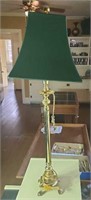 Gold colored shade lamp with green shade