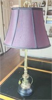Maroon shade lamp with gold colored base