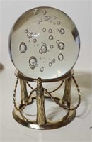 Glass globe on stand bottom is flat