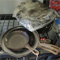 Various Cast Iron Skillets And A Dutch Oven