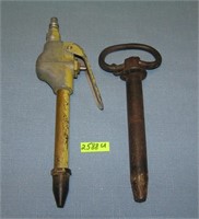 Milton air nozzle and an antique iron push pin