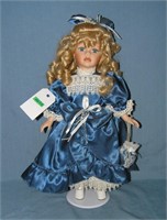 Fancy porcelain doll with silk dress