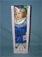 Porcelain doll in fancy blue dress