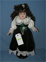 Beatuiful porcelain doll with fancy dress and pear
