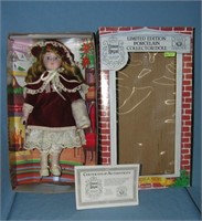 Porcelain doll with beatuful maroon dress and hat