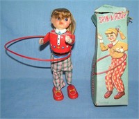 Spin-A-Hoop wind up all tin mechanical toy