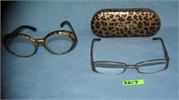 Guess eyeware with a case and a another pair of gl
