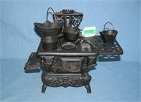 Cast iron Crescent child's stove loaded with cast
