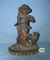 Large cast iron woodsman with axe and smoking pipe