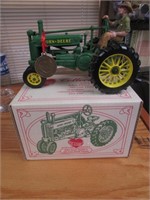 we care john deere model A toy tractor w/box