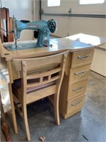 Deluxe Sewing Machine in cabinet with chair