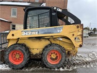 John Deere 318 skid loader with a door