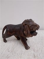 Wooden lion sculpture