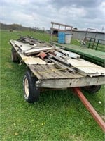 4 WHEEL WAGON W/STACK OF METAL ROOFING (ALL SELLS