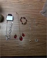 Five pieces of costume jewelry One new