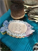 Set of four pastel fish dishes