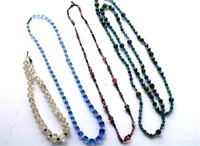 FOUR GLASS BEADED NECKLACES