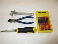 Tool set with screwdrivers, wire cutter, wrench