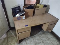 Wooden desk with contents