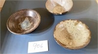 Three pottery handmade bowls, 9 1/2 inches by 2