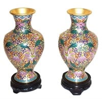pair brass cloissone style vases on wooden stands