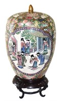 Chinese porcelain lidded jar on a wooden stand