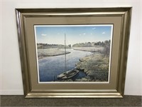 Framed decorative print of sailboat on a river