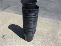 Stack of Black Plastic Flower Pots