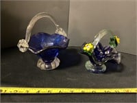 Two blue glass decorative baskets