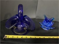 Blue glass basket, flower candle holder and bird