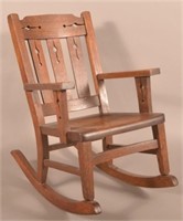 Arts & Crafts Period Child's Oak Rocking Chair.