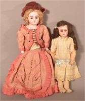 Two Antique German Bisque Head Girl Dolls.