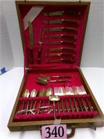 27 PC BRONZE AND THAI ROSEWOOD CUTLERY IN CASE