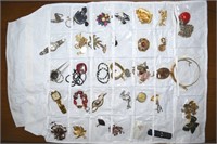 Hanging Storage full of Costume Jewelry: Brooches+