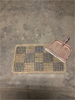 Braided rug and metal dust pan