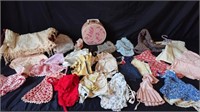 Vintage doll clothes and carry case and bed