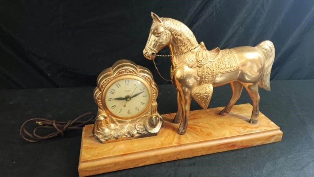 United brass tone horse/clock with bakelite base