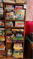 Bookshelf and approx 50 puzzles