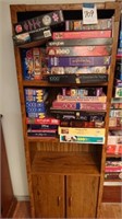 Bookshelf and approx 28 puzzles