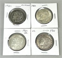 Four 1921 Morgan Silver Dollars.